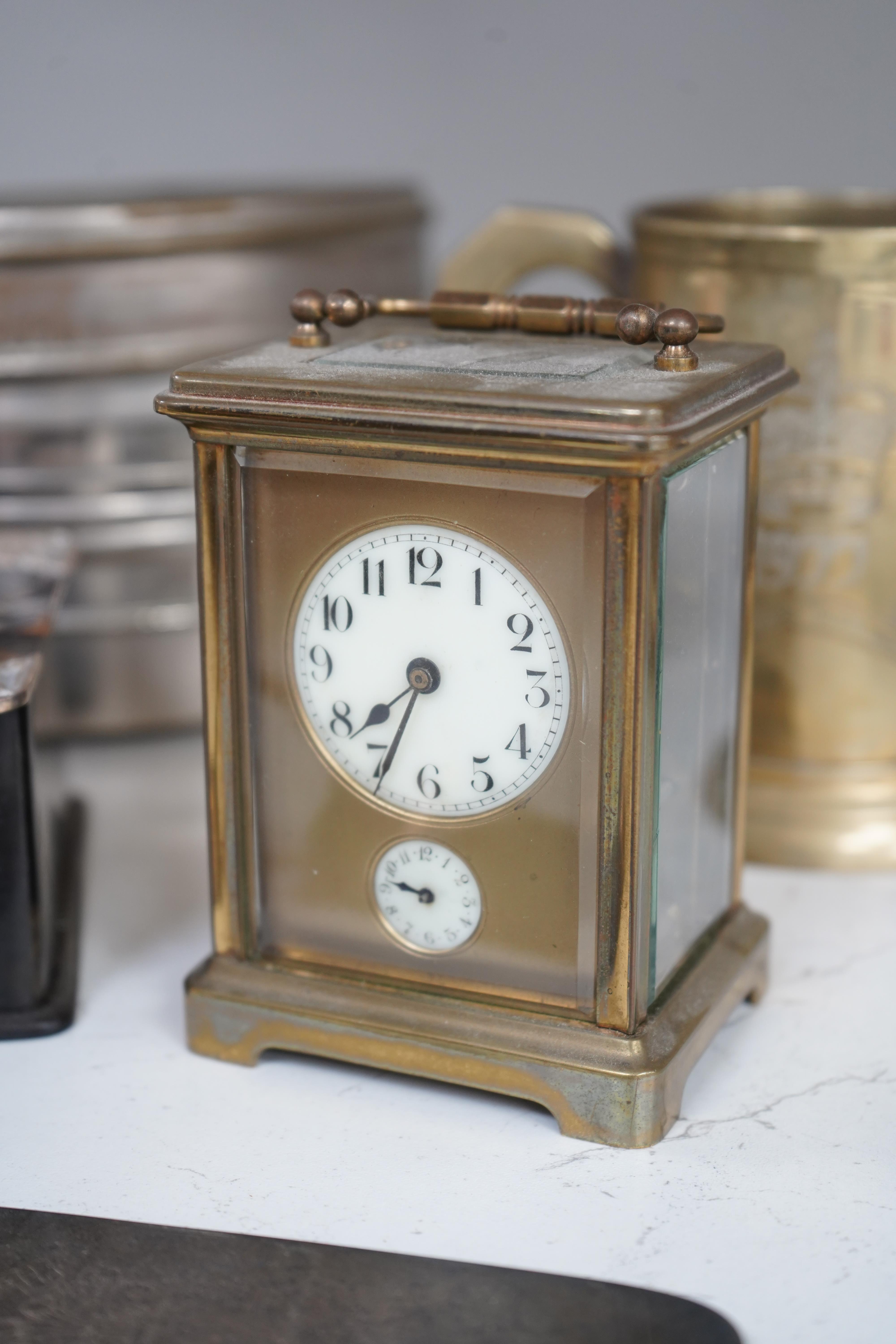 A small collection of metalware to include a white metal mounted tortoiseshell box, brass cased carriage clock with subsidiary dial and a pewter tankard. Condition - poor to fair